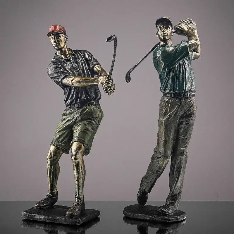 Two detailed bronze-colored decorbites golf figure statues featuring a red cap and teal polo for office decor
