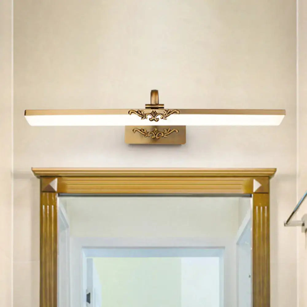 Gold-finished ornate vintage bronze wall light fixture with rectangular led panel and decorative scrollwork for bedroom vanity