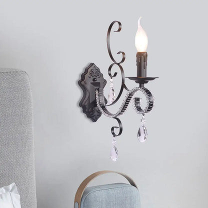 Antique bronze wrought iron wall mounted lamp with crystal teardrop pendants and candle style bulb for living room