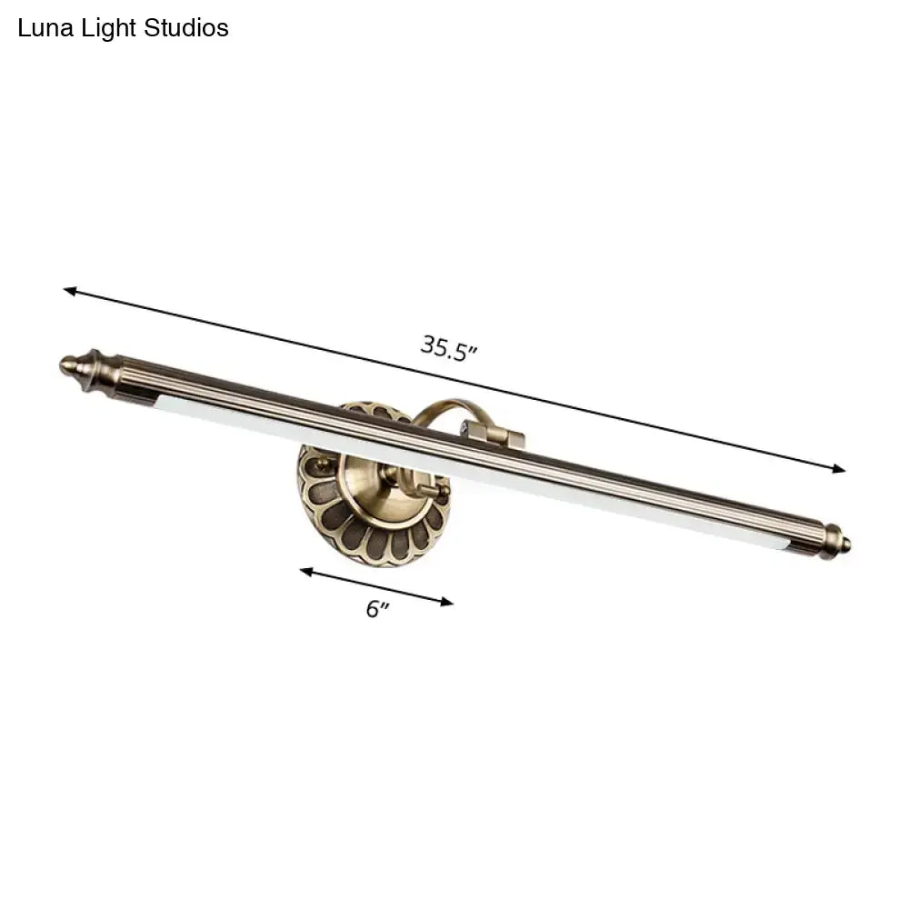 Antique brass-finished metallic sconce wall light with scalloped base and elongated body for bedroom lighting with maximum bulb wattage