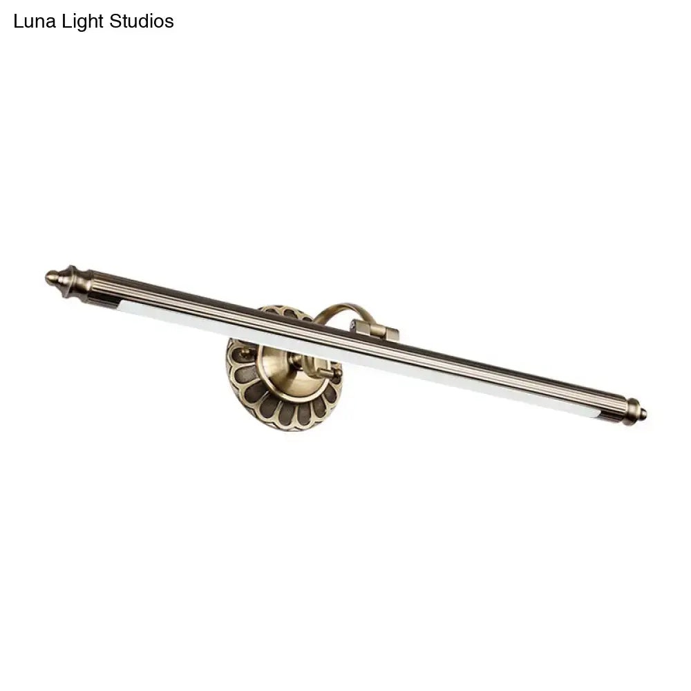 Vintage brushed brass metallic sconce wall light with scalloped backplate and sleek elongated bar design for bedroom lighting