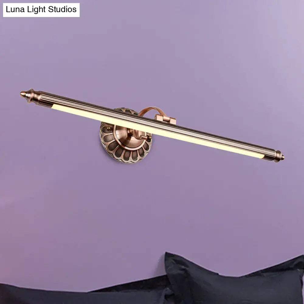 Antique brass-finished metallic sconce wall light with slender design and scalloped base for bedroom vanity lighting maximum bulb wattage specified