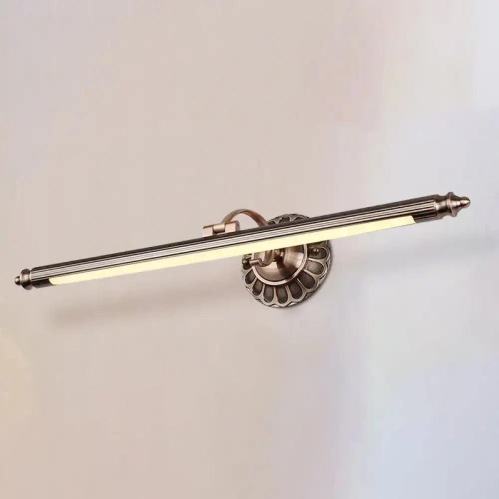 Antique brass-finished metallic sconce wall light with elongated design and fluted base for bedroom with led bulbs maximum wattage use