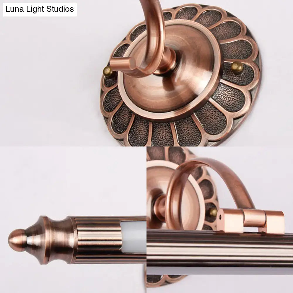 Vintage brushed brass metallic sconce wall light with scalloped textured base and slender curved arm for bedroom lighting