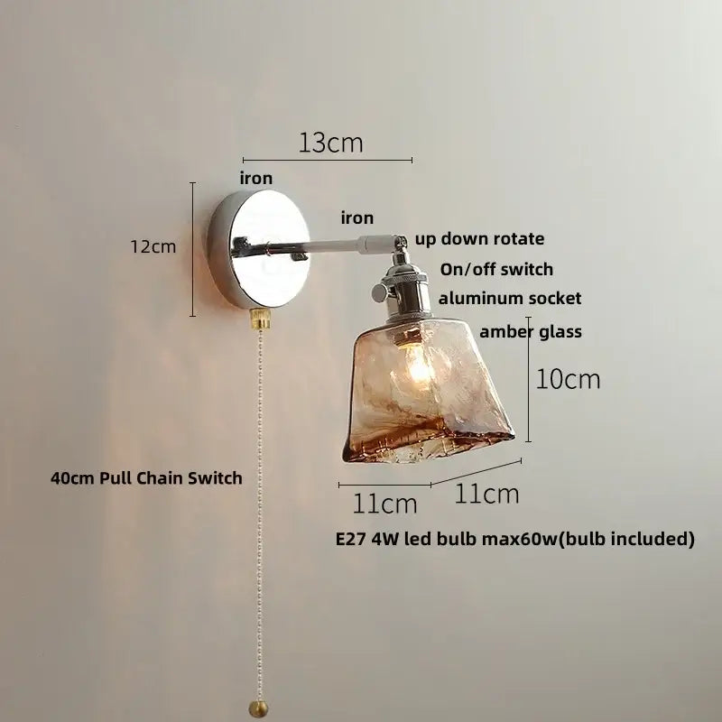 Vintage brushed nickel led wall light with polished iron base amber glass shade and adjustable arm for bedroom use