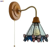 Vintage butterfly glass wall light with copper arm wooden backplate and pink and blue stained glass shade decorbites butterfly glass