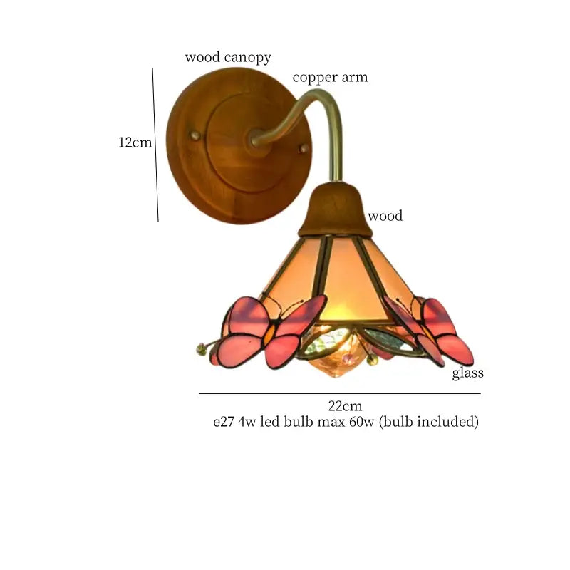Vintage wall light with copper arm and warm-toned decorbites butterfly glass in pink and amber hues
