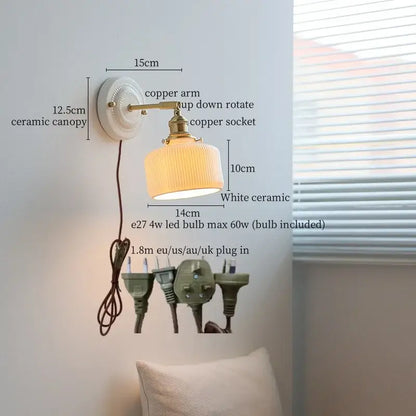 Vintage wall sconce light with white ribbed ceramic shade and brass copper arm featuring a bedroom pull chain