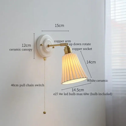 Vintage white ceramic and brass wall sconce light with fluted shade and copper arm for bedroom with pull chain