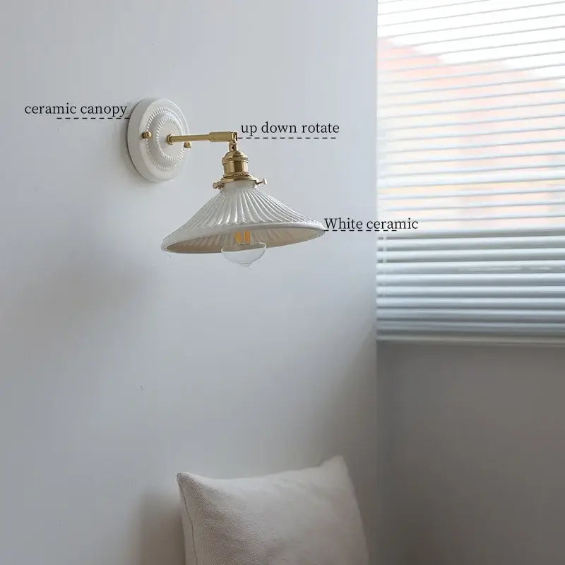White ceramic led wall lamp with fluted ridged shade and brass-finished arm for vintage bedroom decorbites ceramic led wall