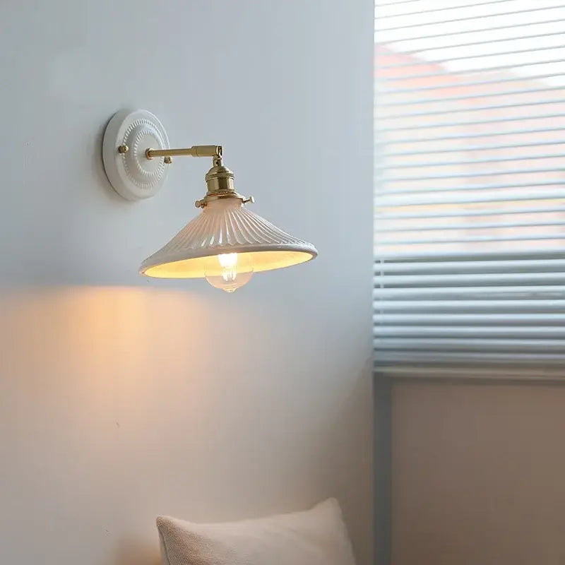 White ceramic led wall lamp with gold-toned metal arm and fluted shade for vintage bedroom decorbites ceramic led wall