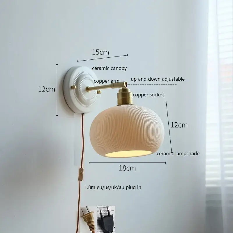 A warm-toned decorbites ceramic wall lamp with ribbed glass shade and brass accents for bedroom wall decor