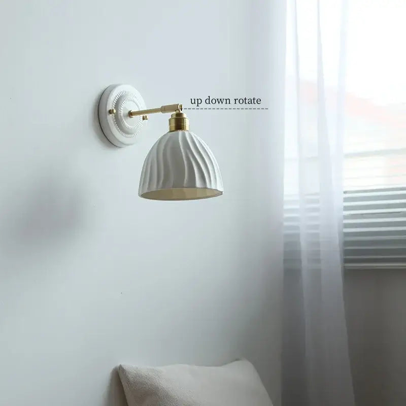 Vintage ceramic wall sconce with white ceramic shade and gold-toned metal arm for bedroom decorbites ceramic wall use