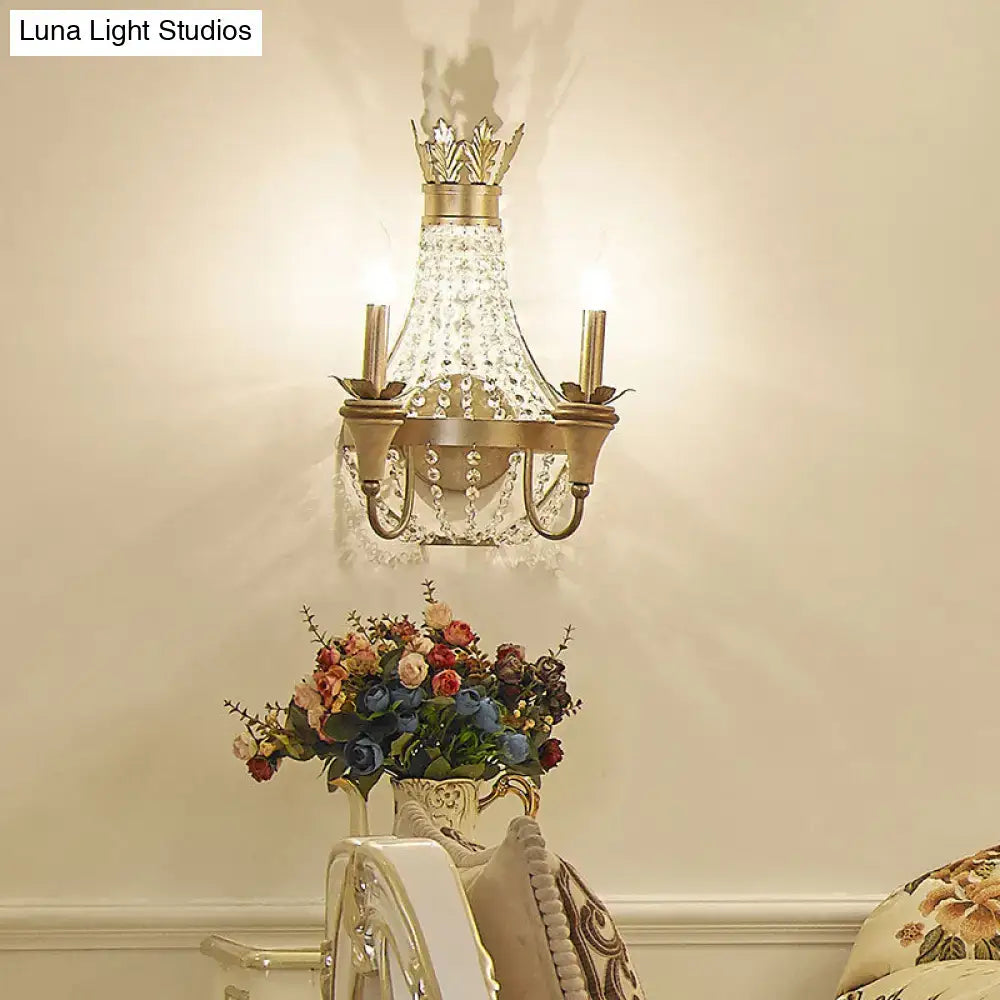 Vintage champagne finish wall light with gold tone chandelier style and clear crystal droplets for living room decor