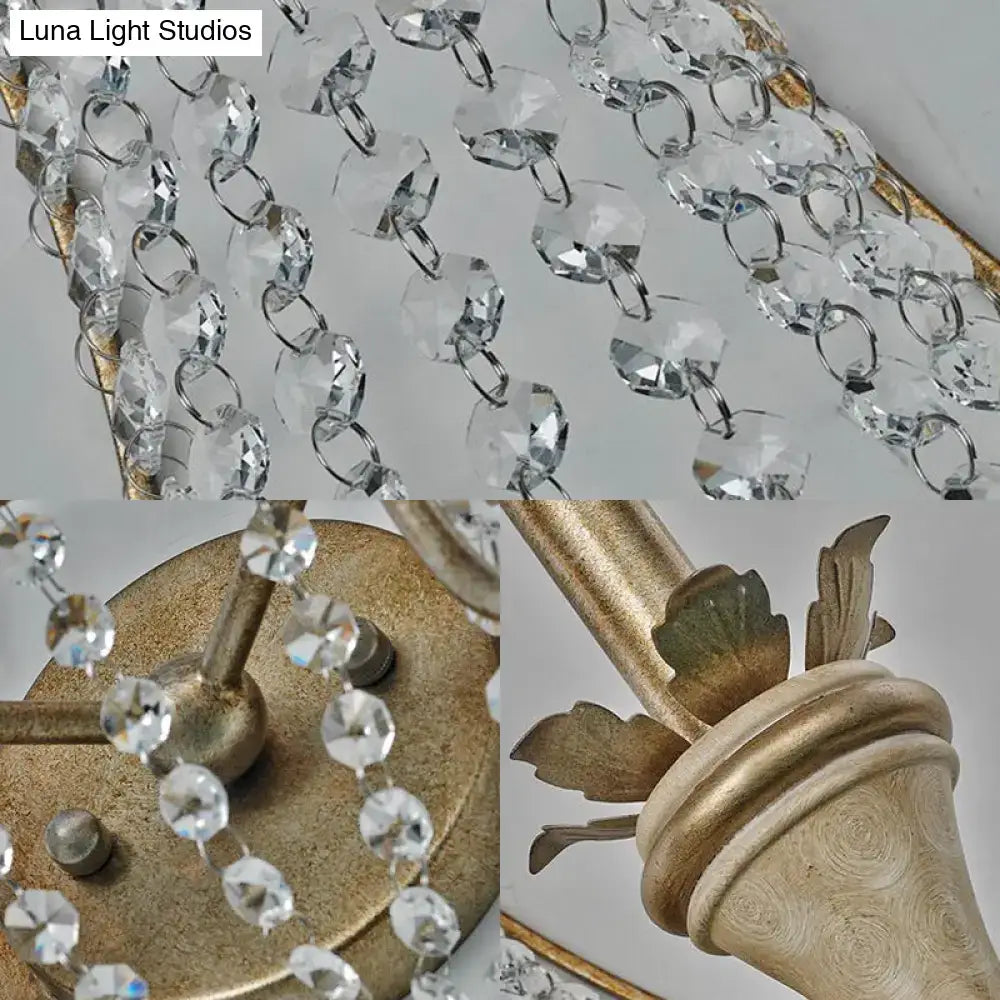 Vintage champagne finish wall light with clear crystal beads and gold-finished metal frame for living room