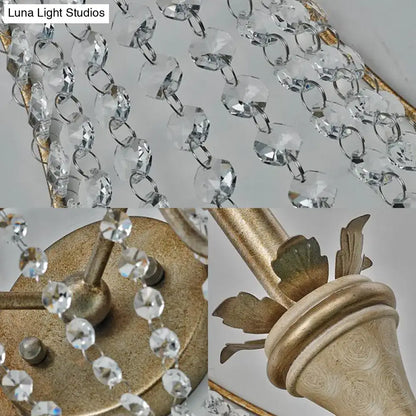 Vintage champagne finish wall light with clear crystal beads and gold-finished metal frame for living room