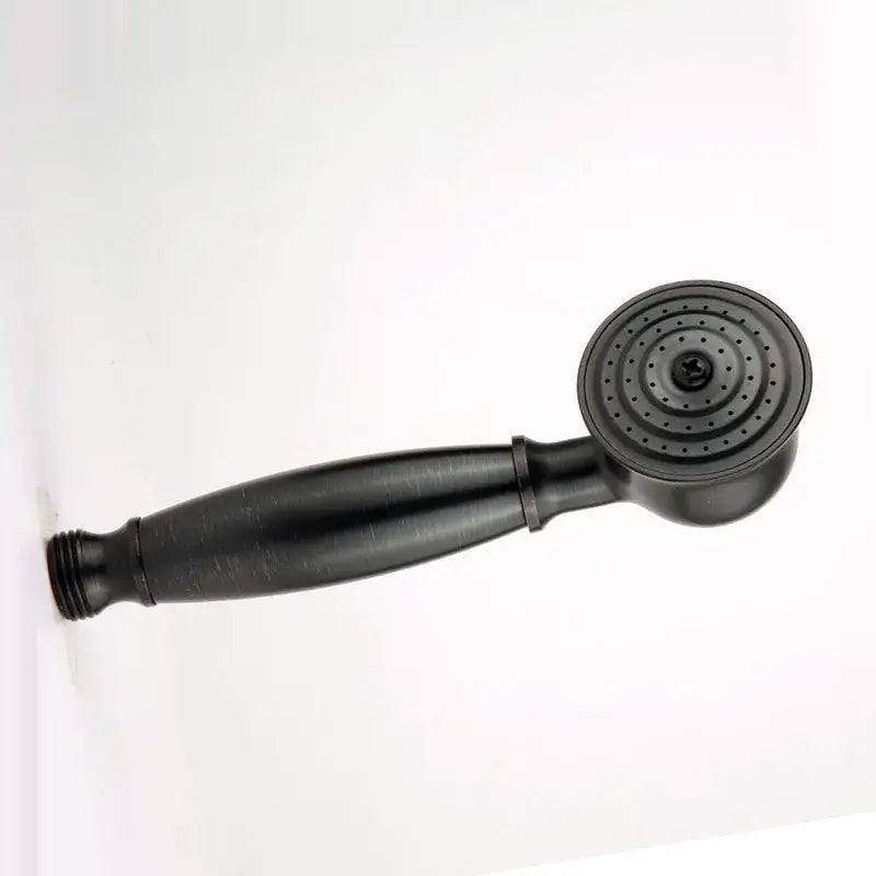Black matte handheld showerhead with circular spray face and textured grip paired with vintage chrome and ceramic shower hand holder