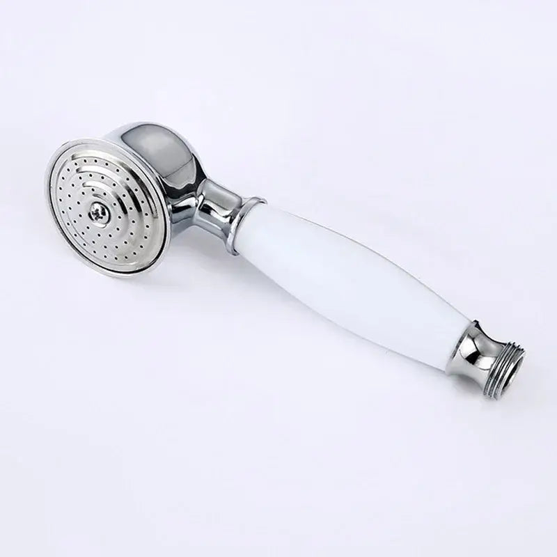 Vintage chrome and white ceramic shower hand holder with chrome finished showerhead and perforated spray face