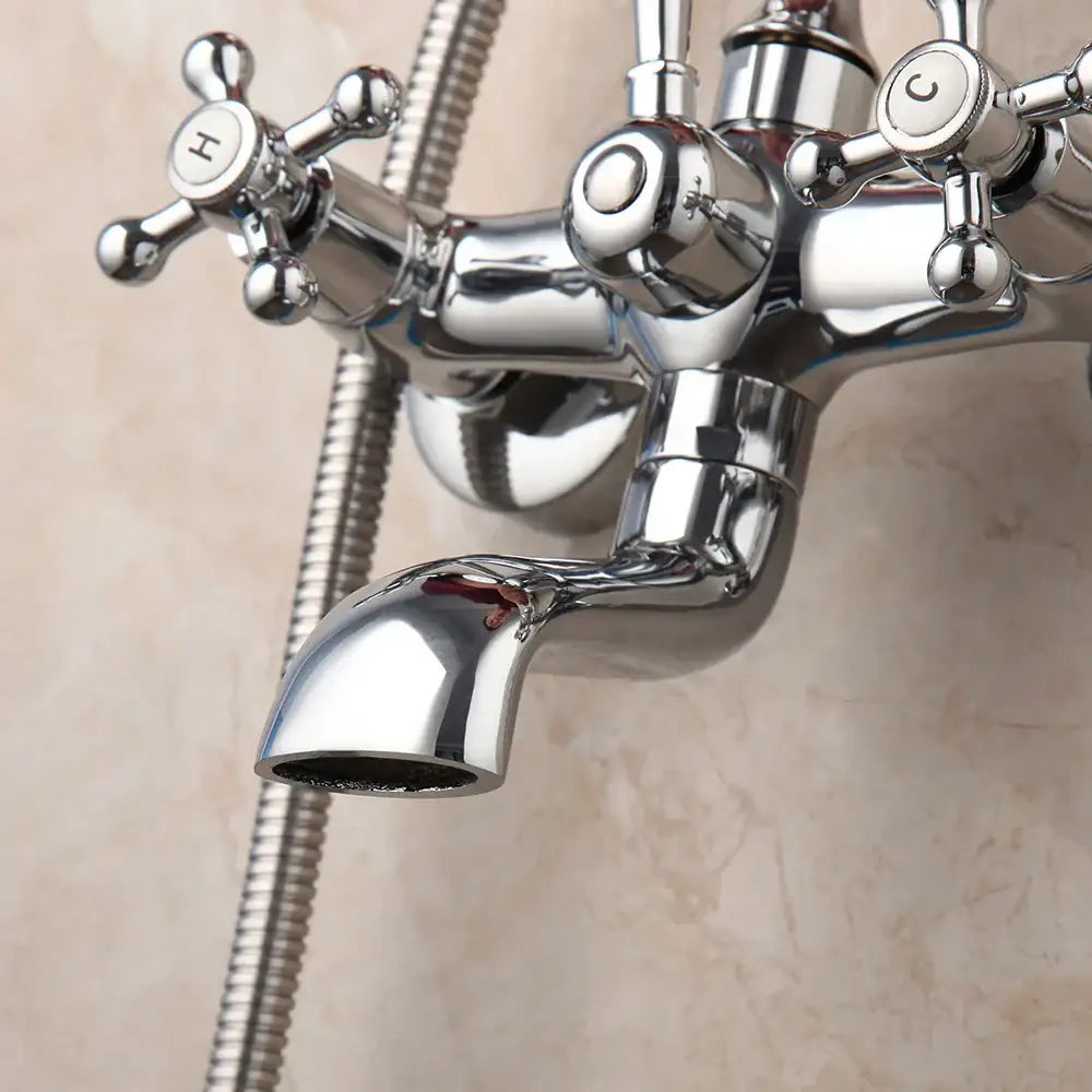 Vintage chrome brass bathroom faucet set with cross handles marked h and c featuring a sleek brass bathroom faucet design