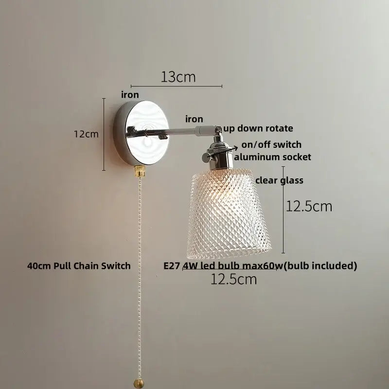 A vintage chrome clear glass wall sconce with a polished iron base and diamond cut clear glass shade decorbites clear glass