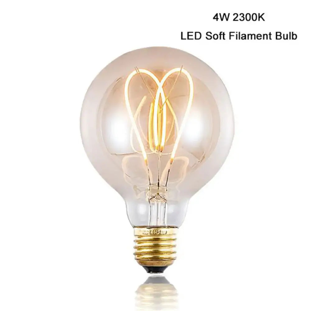 A warm glowing dimmable 4w led globe edison bulb with clear glass and intricate golden filaments for living room light