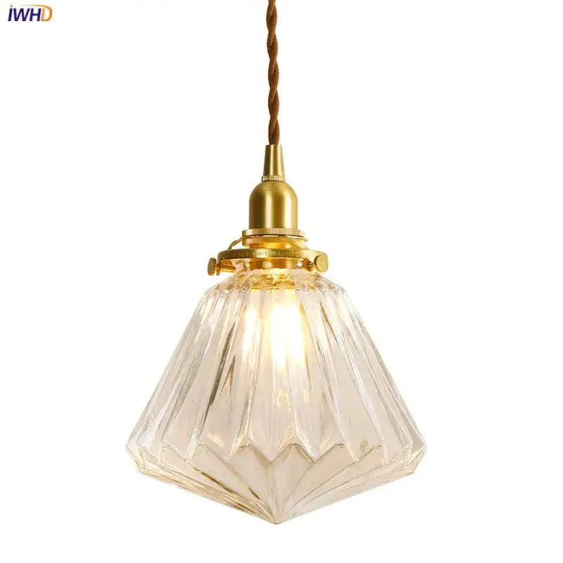 Vintage clear and red glass pendant light with a brass fixture and twisted brown cord decorbites glass lamp
