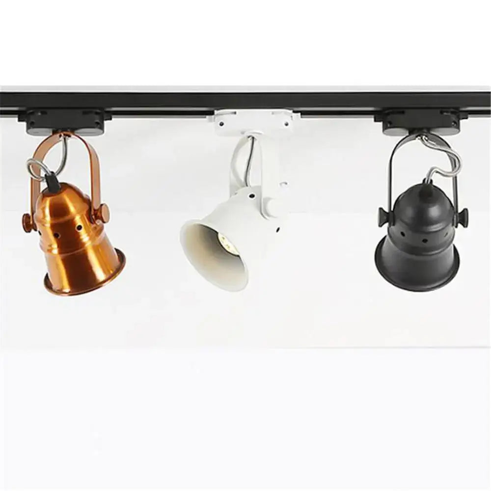 Three vintage copper and black gu10 led track lights with white finish hang on a sleek black rail for kitchen use decorbites gu10 led
