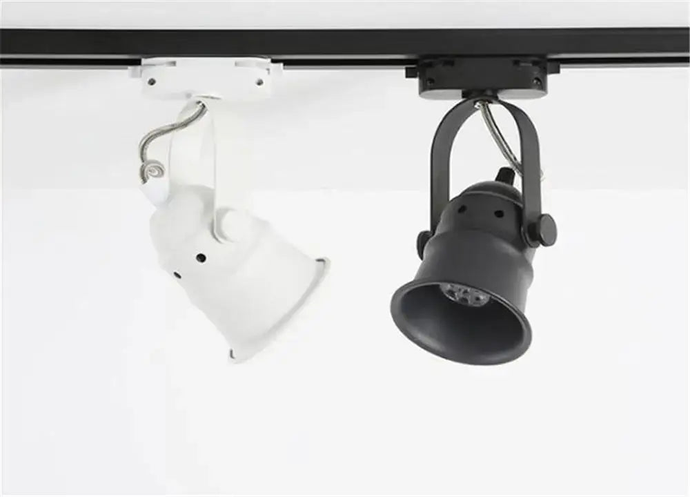 Two adjustable vintage copper and black gu10 led track lights on a metal rail from decorbites gu10 led collection