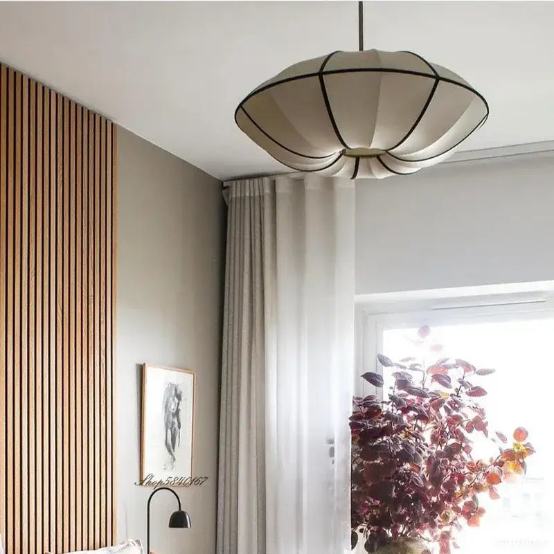 Cream-colored danish fabric pendant lamp with geometric segments and black trim for dining room decorbites danish fabric decor