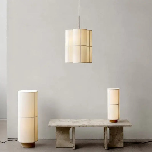 Cream-colored cream fabric hashira cluster pendant light and table lamps with segmented fabric shades and wooden bases