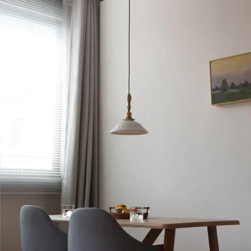 Vintage cream glass and brass adjustable led pendant dining room light with warm brass fixture and off-white ceramic shade