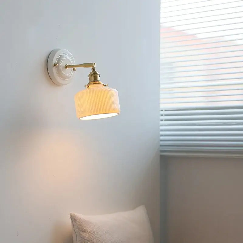 Vintage cream ribbed glass ceramic led wall lamp with brass finish arm for bedroom decorbites ceramic led wall lighting