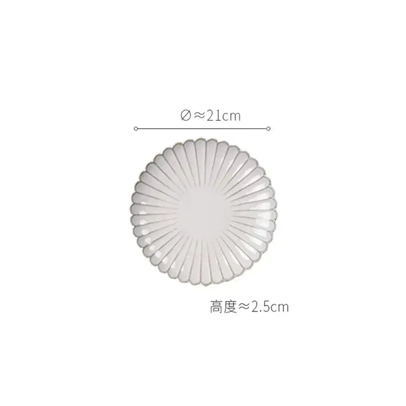 Translucent white ceramic plate with scalloped edge and radial ridges from vintage cream scalloped dining table set