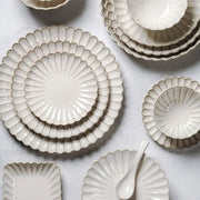 Set of cream ceramic plates with scalloped edges and gold trim for vintage cream scalloped ceramic dining table set