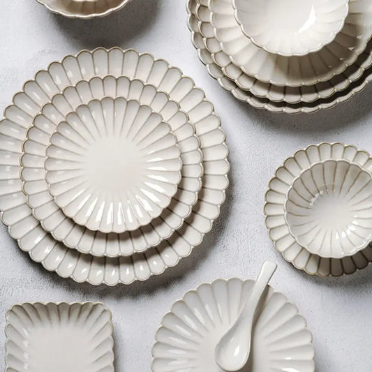 Set of cream ceramic plates with scalloped edges and gold trim for vintage cream scalloped ceramic dining table set