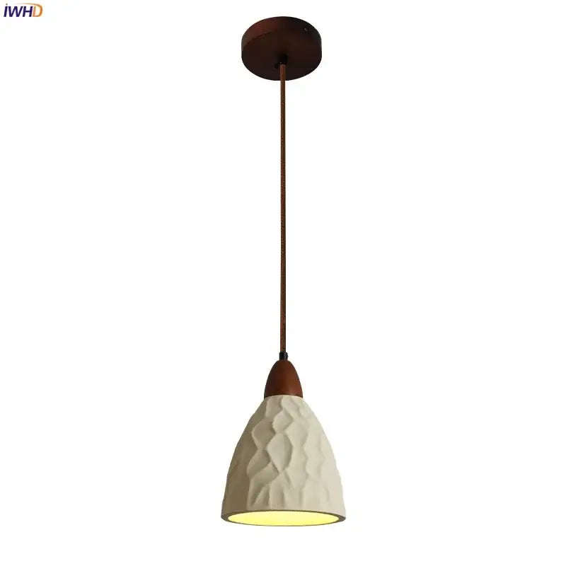 A cream textured ceramic decorbites loft decor pendant light with dark wood ceiling mount and cord for loft decor led use