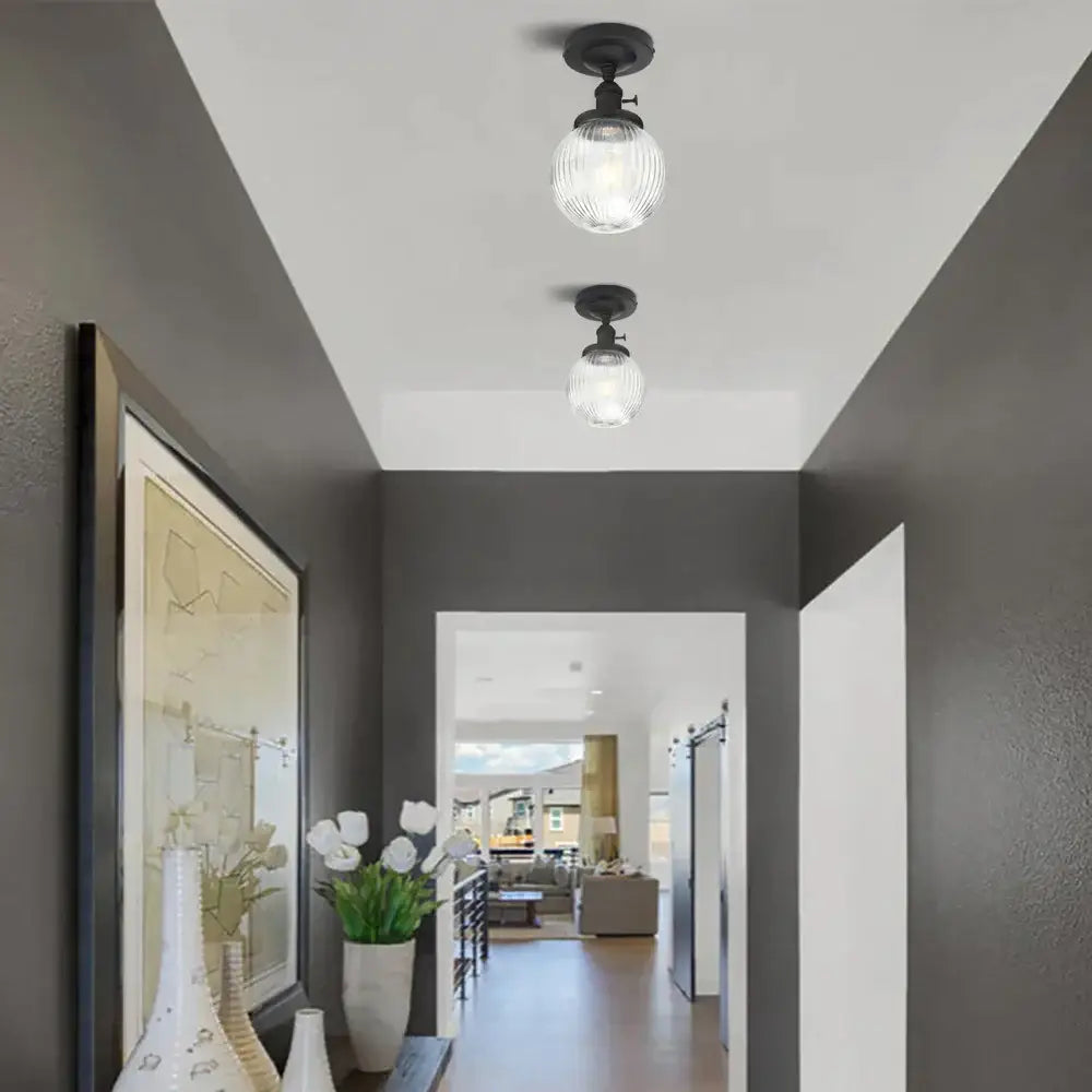 Two black-finished semi flush mount ceiling lights with vintage dark bronze ribbed textured glass globes for bedroom