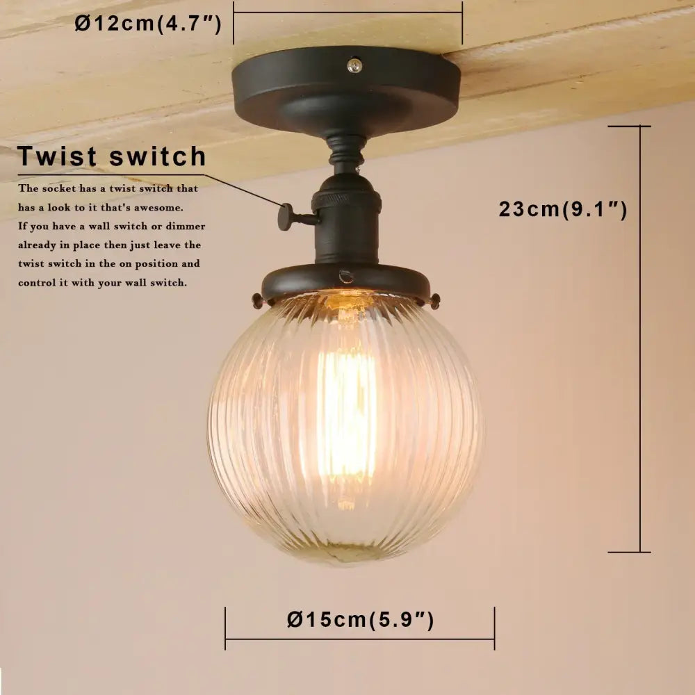 Vintage dark bronze semi flush mount ceiling light with black metal fixture and clear ribbed glass globe for bedroom use