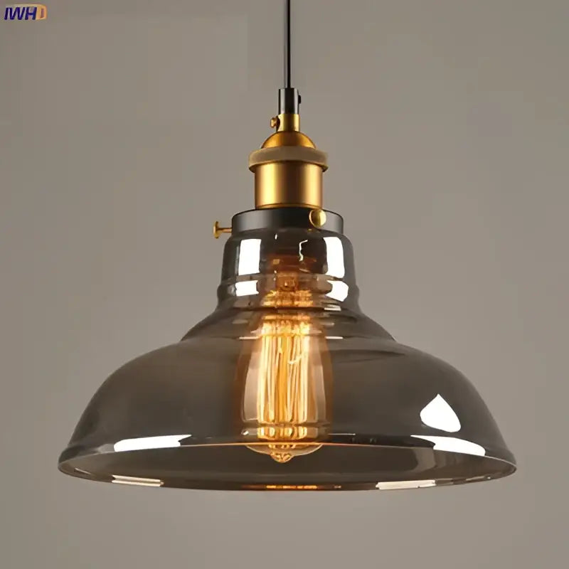 Vintage dark glass pendant lights set of 4 with smoked glass shades and brass accents featuring exposed Edison bulbs