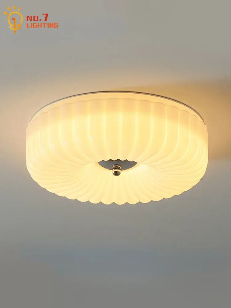 Warm-toned decorbites cream glass ceiling light with frosted ridged shade and metallic rim for bedroom use