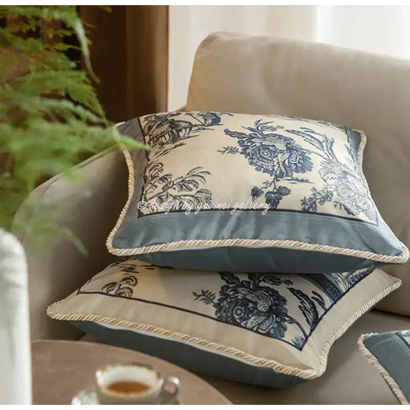 Vintage delft blue toile cushion cover with blue and cream floral pattern and textured rope trim decorbites delft blue