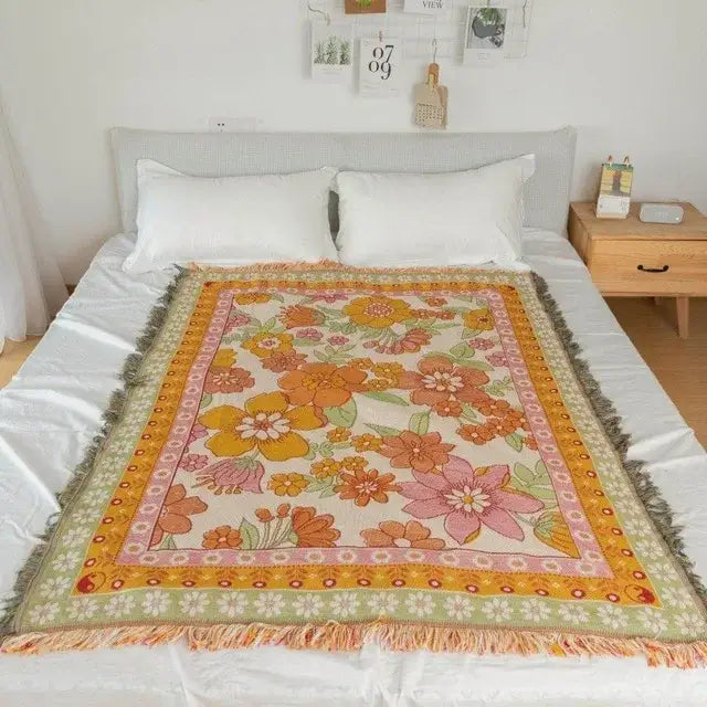A cozy vintage-style floral throw blanket with layered borders in cream and earth tones for bohemian cotton plaid sofa decorbites
