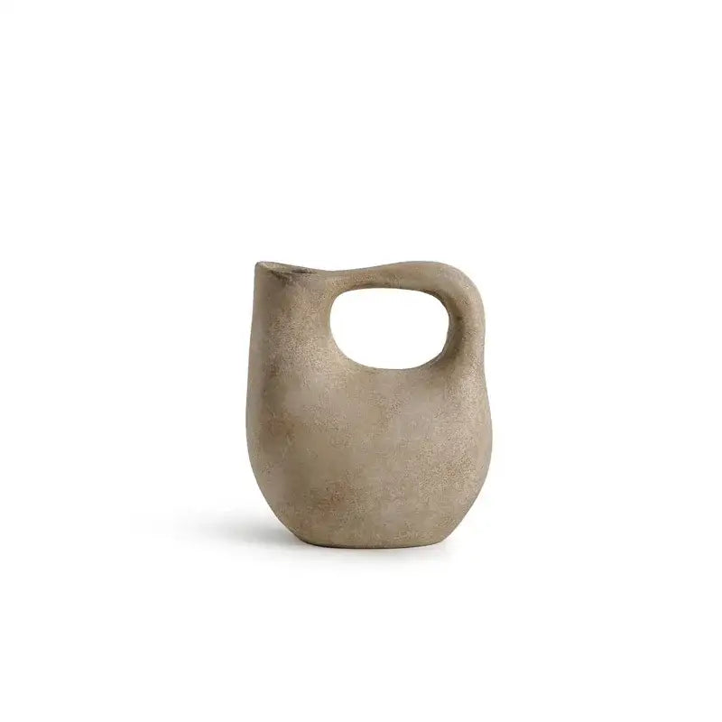 Minimalist concrete pitcher with smooth matte finish and integrated handle in vintage earthy geometric stoneware decorbites set