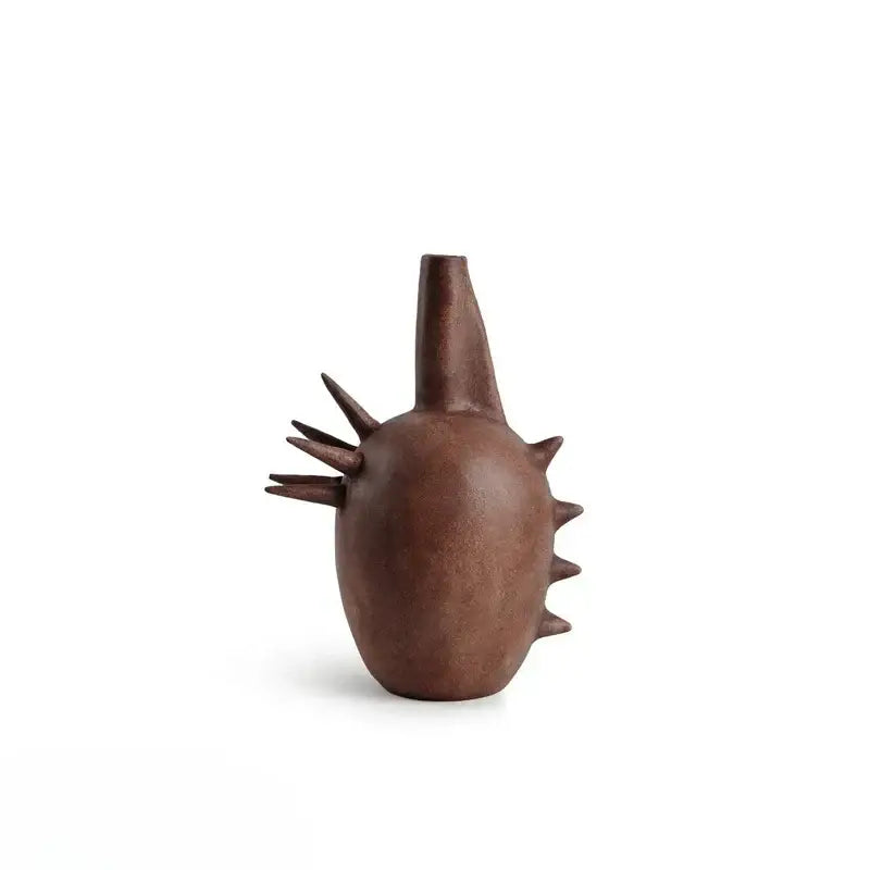 Brown ceramic geometric stoneware vase with rounded body and spiky protrusions for living room decor by decorbites