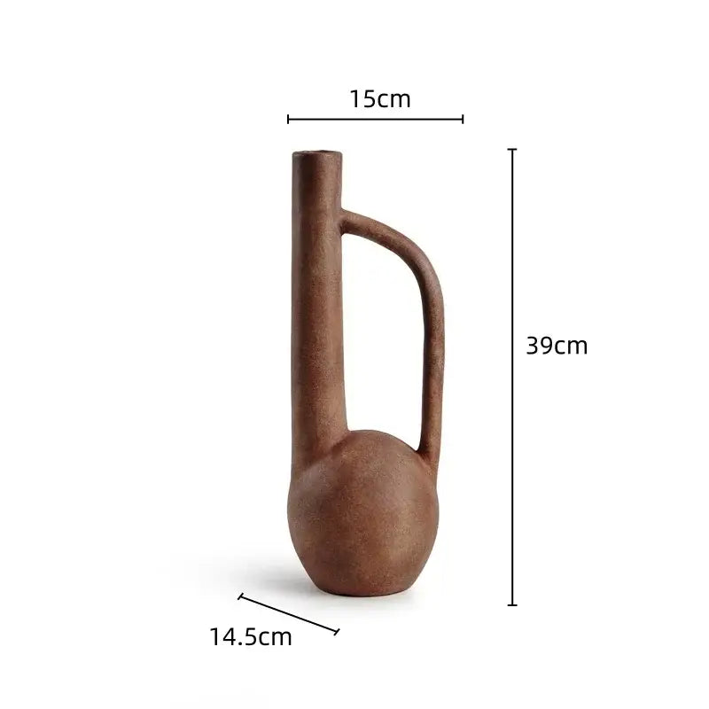 A rustic brown ceramic geometric stoneware vase with slender neck and curved handle for living room decorbites decor