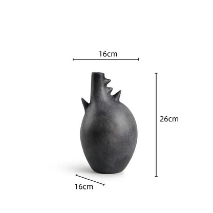 A sleek matte black ceramic decorbites geometric stoneware vase with spiky neck for vintage earthy living room decor