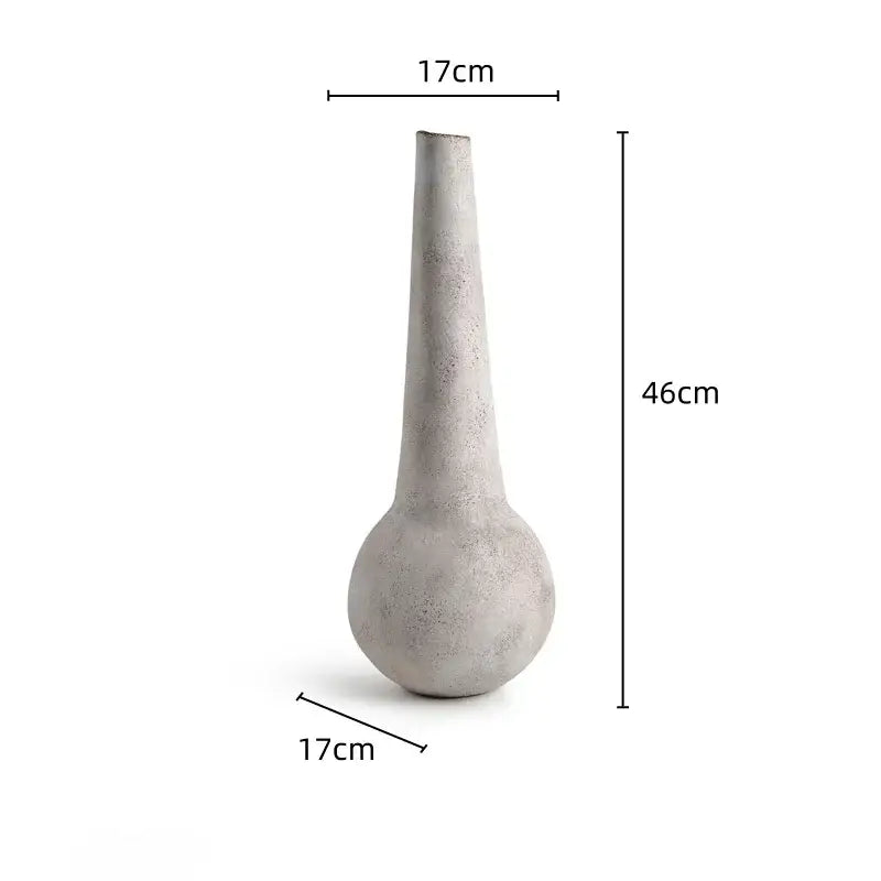 A tall slender concrete geometric stoneware vase with rounded base and tapered neck for vintage living room decorbites decor