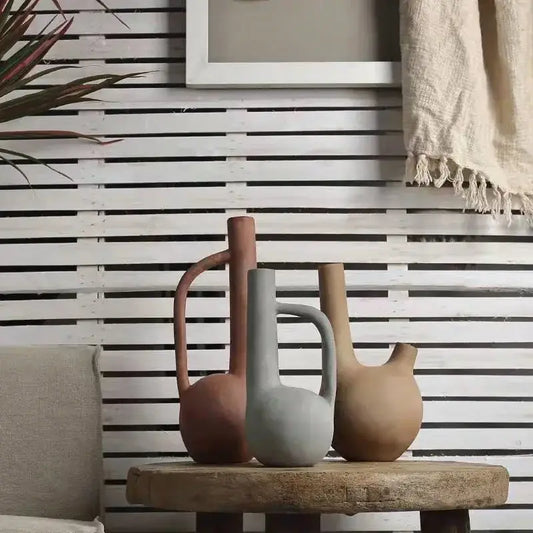 Three earthy terracotta gray beige geometric stoneware vases with rounded bodies and handles for living room decorbites decorbites geometric stoneware