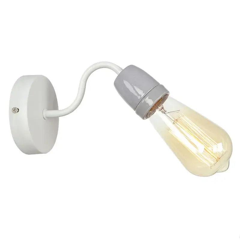 A sleek white wall lamp with a curved arm and exposed filament bulb from decorbites colorful ceramic led collection