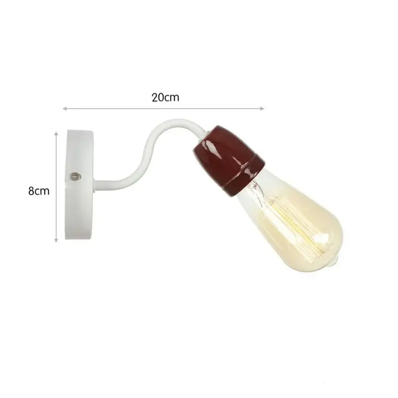 White wall lamp with curved arm and brown-capped clear glass bulb from decorbites colorful ceramic led collection
